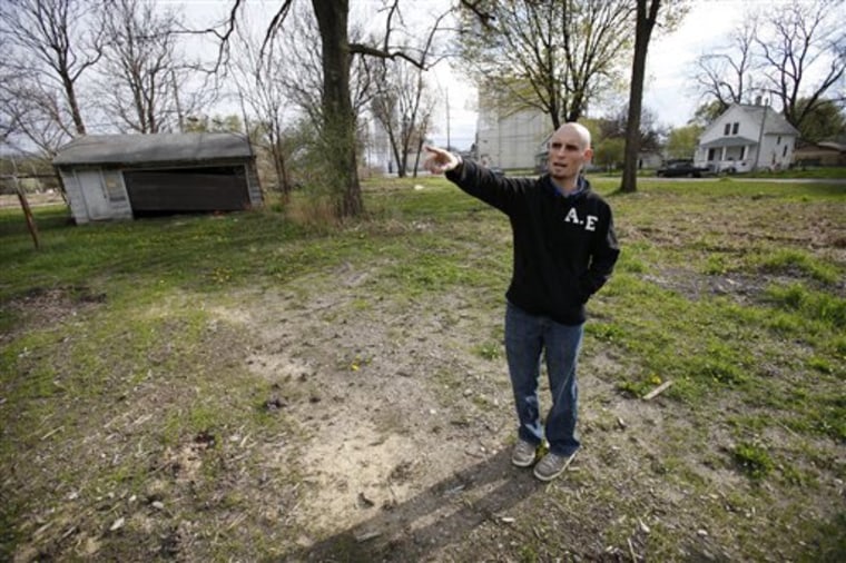 Justin Van Fleet stands at the site of where his home once stood before the flood of 2008, in Cedar Rapids, Iowa. Van Fleet is among thousands who have received letters in recent weeks from the Federal Emergency Management Agency notifying them they received too much money from the agency dating back to 2005 and now must pay it back. 